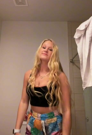 6. Sultry Caiti Mackenzie Shows Cleavage in Black Crop Top