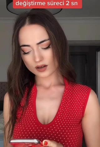 Sultry Ceylan Shows Cleavage in Red Top