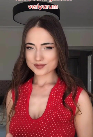 Luscious Ceylan Shows Cleavage in Red Top