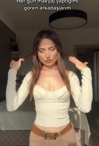 2. Titillating Ceylan Shows Cleavage in White Crop Top