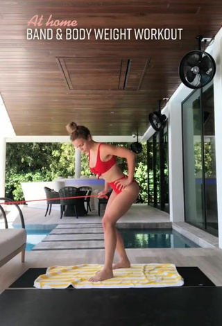 5. Sultry Elle Leonard in Red Bikini while doing Fitness Exercises