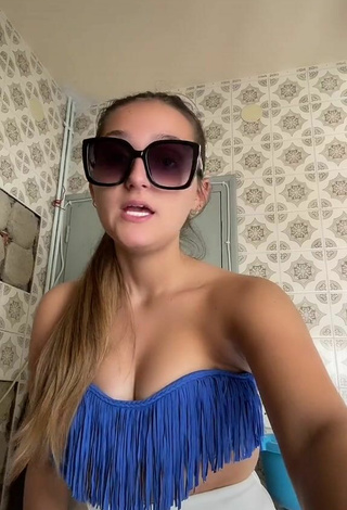 Luscious Eva Cstt Shows Cleavage in Blue Bikini Top