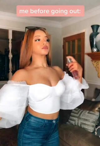 Luscious Faith Thigpen Shows Cleavage in White Crop Top