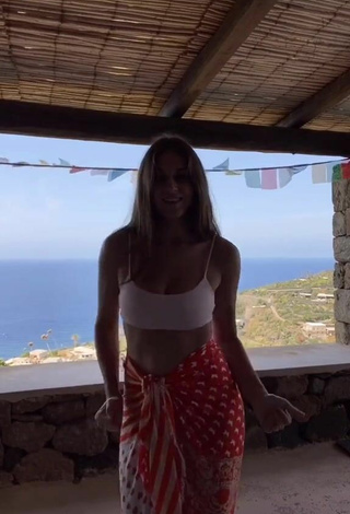 2. Sultry Gaia in White Crop Top on the Balcony