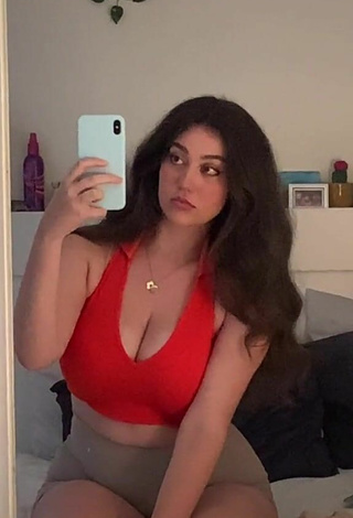 Breathtaking Simone Shows Cleavage in Red Crop Top