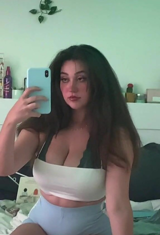 Sensual Simone Shows Cleavage in White Crop Top