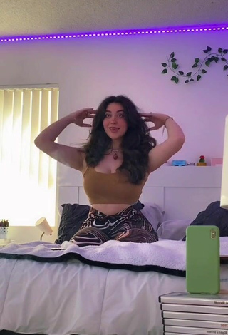 4. Lovely Simone Shows Cleavage in Olive Crop Top