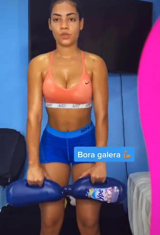 4. Hottest Ingrid Muniz Shows Cleavage in Orange Sport Bra while doing Fitness Exercises