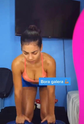 5. Hottest Ingrid Muniz Shows Cleavage in Orange Sport Bra while doing Fitness Exercises