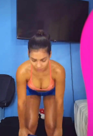 6. Hottest Ingrid Muniz Shows Cleavage in Orange Sport Bra while doing Fitness Exercises