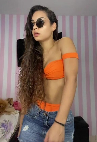 3. Sexy Ingrid Muniz Shows Cleavage in Orange Bikini Top