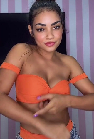 6. Hot Ingrid Muniz Shows Cleavage in Orange Bikini Top