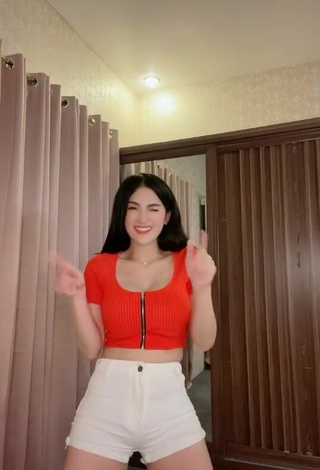 6. Titillating Karen Anne Tuazon in Orange Crop Top