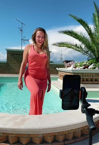 Sultry lalequita in Red Dress at the Swimming Pool