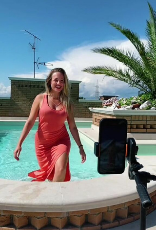 2. Sultry lalequita in Red Dress at the Swimming Pool