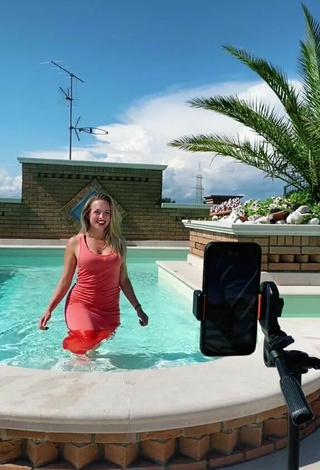 4. Sultry lalequita in Red Dress at the Swimming Pool