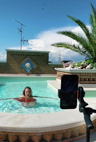 6. Sultry lalequita in Red Dress at the Swimming Pool