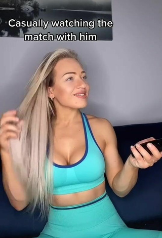 Sweetie Maria Shows Cleavage in Blue Sport Bra