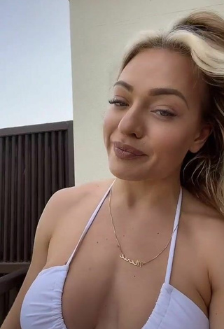 2. Titillating Maria Shows Cleavage in White Bikini Top