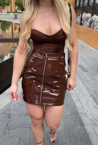 3. Luscious Maria Shows Cleavage in Brown Top