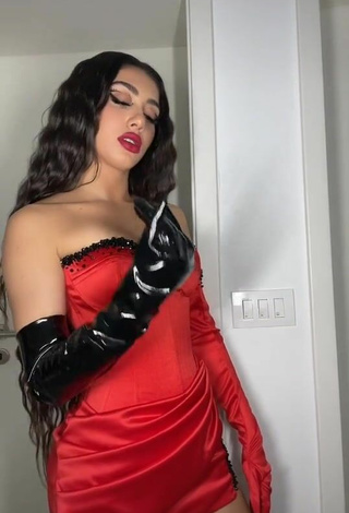 4. Sultry Melinda Ademi in Red Corset