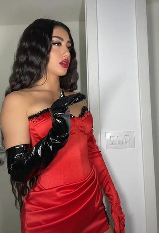 5. Sultry Melinda Ademi in Red Corset