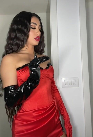 6. Sultry Melinda Ademi in Red Corset