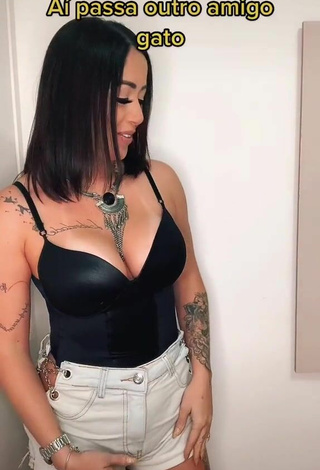 4. Luscious Naiara Coelho Shows Cleavage in Black Top