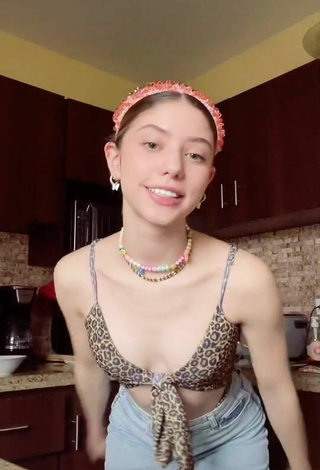 Luscious Paula Dobles Shows Cleavage in Leopard Crop Top