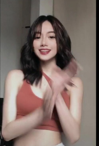 6. Paulaxdrea Shows Cleavage in Cute Orange Crop Top