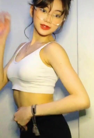 2. Titillating Paulaxdrea Shows Cleavage in White Crop Top