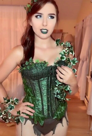 5. Sultry Ari in Green Corset