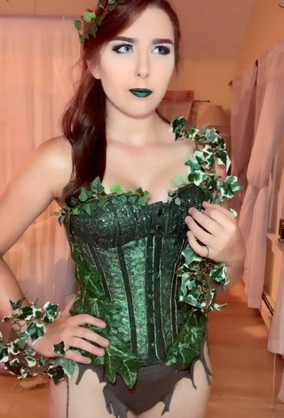 6. Sultry Ari in Green Corset