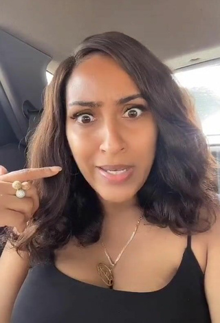 2. Titillating Juliet Ibrahim Shows Cleavage in a Car