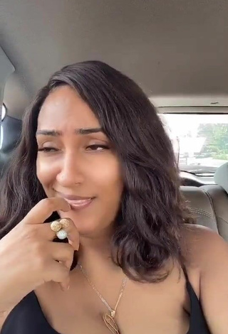 3. Titillating Juliet Ibrahim Shows Cleavage in a Car