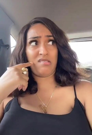 6. Titillating Juliet Ibrahim Shows Cleavage in a Car