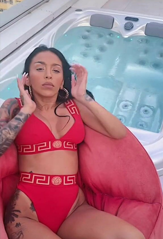 Luscious Ruby Shows Cleavage in Red Bikini