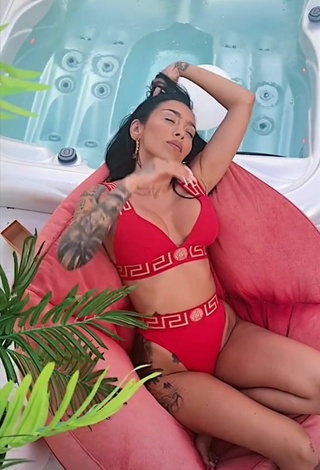 6. Luscious Ruby Shows Cleavage in Red Bikini