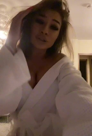 6. Sultry Simonna Braboveanu Shows Cleavage in White Bathrobe