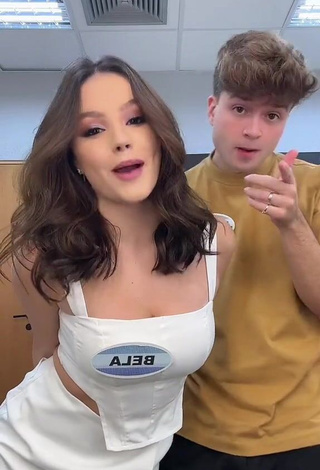 Titillating bela Shows Cleavage in White Crop Top