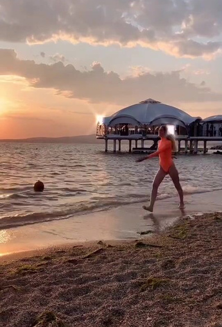 Sultry Diana Belitskay in Orange Bodysuit at the Beach