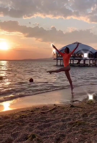 2. Sultry Diana Belitskay in Orange Bodysuit at the Beach