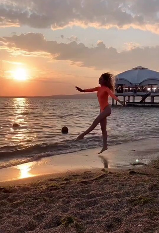 3. Sultry Diana Belitskay in Orange Bodysuit at the Beach