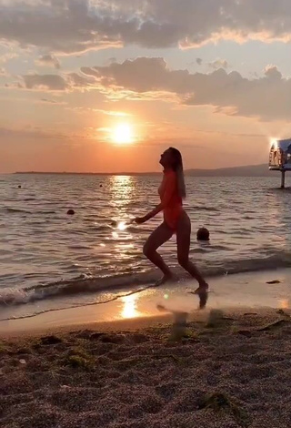 5. Sultry Diana Belitskay in Orange Bodysuit at the Beach