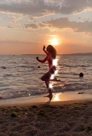 6. Sultry Diana Belitskay in Orange Bodysuit at the Beach