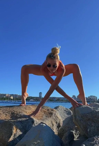 6. Gorgeous Diana Belitskay Shows Cleavage in Alluring Bikini at the Beach while Stretching