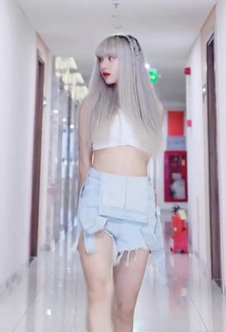 4. Wonderful Bùi Thảo Ly in White Crop Top