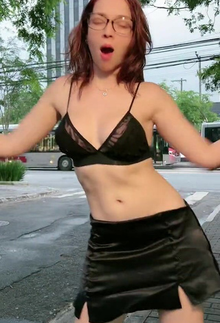 4. Sultry Cibelly Ferreira Shows Cleavage in Black Bra in a Street