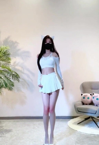 Titillating Han Qui in White Crop Top