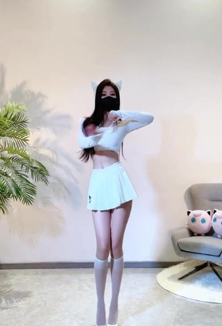 6. Titillating Han Qui in White Crop Top